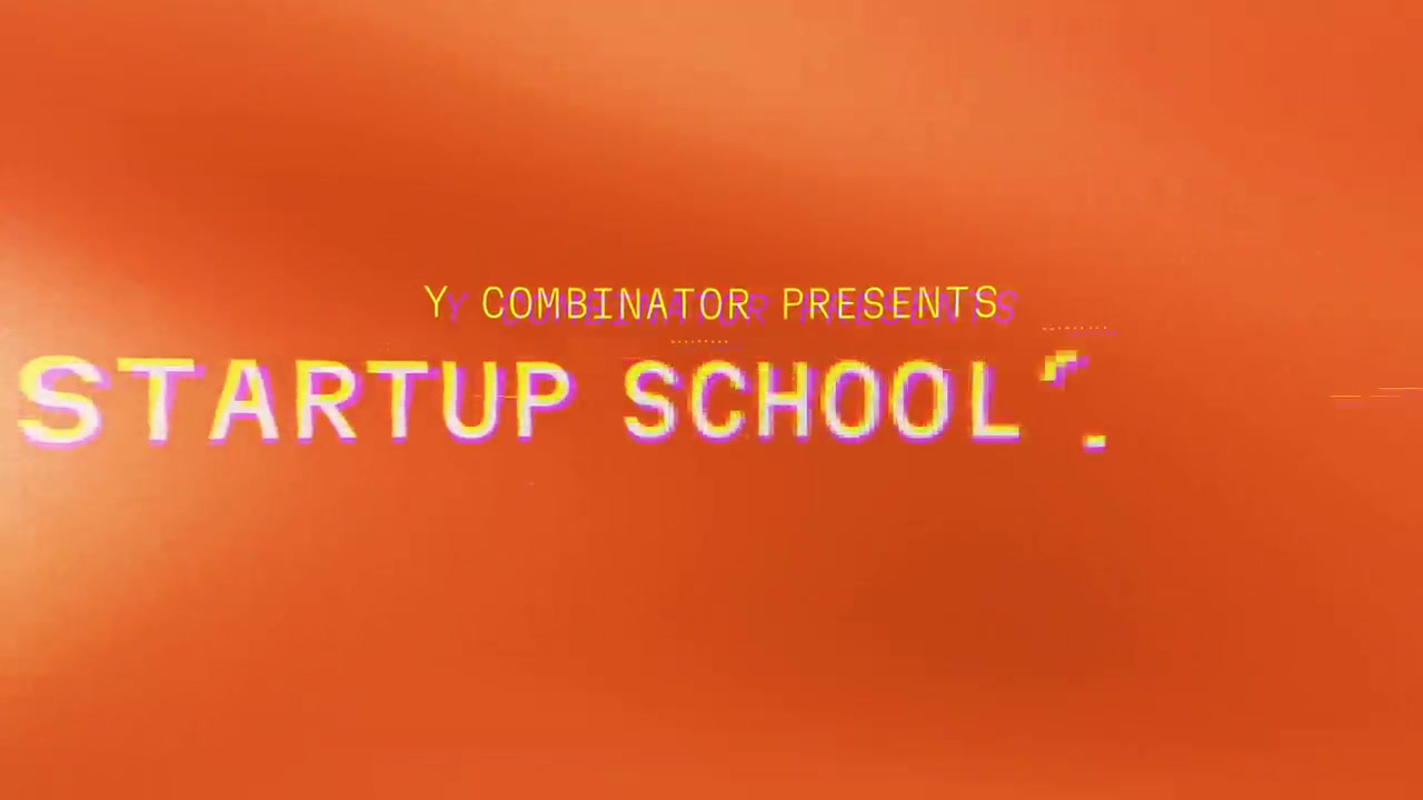 Y Combinator Presents Startup School 标题卡，橙色底